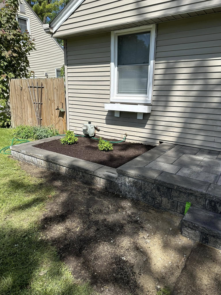 Greener Grounds Lanscape brick wall and patio and landscaping.