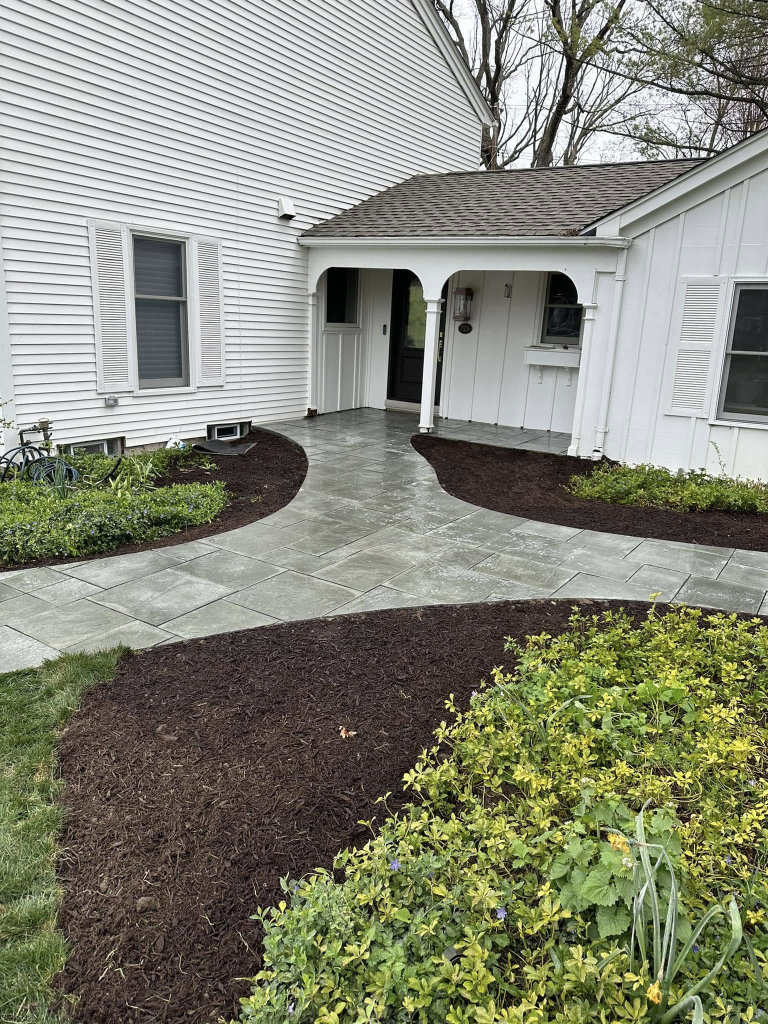Greener Grounds Lanscape brick sidewalk and landscaping.