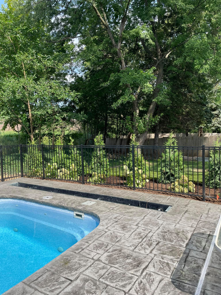 Greener Grounds Lanscape brick pool decking and landscaping.