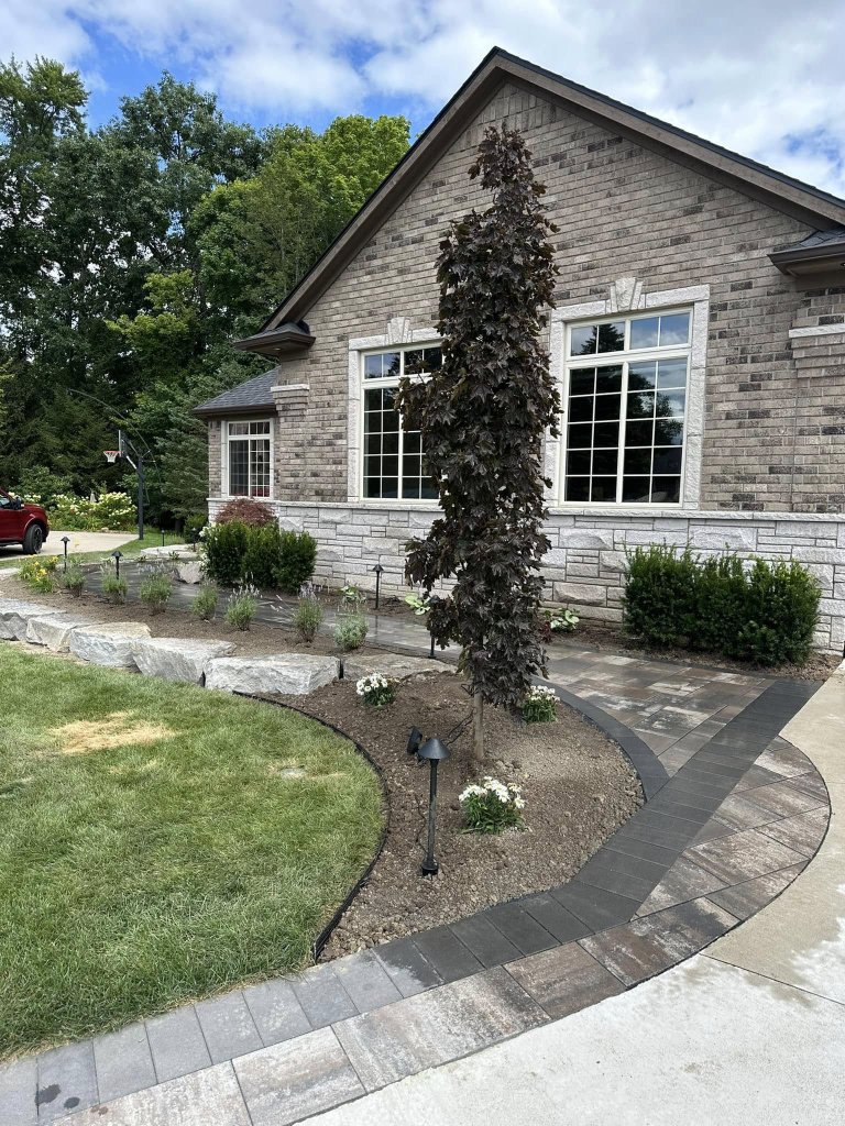 Greener Grounds Lanscape stone and brick walkway and landscaping.